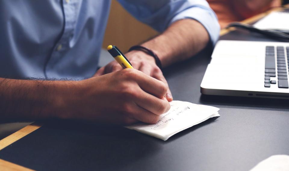 Writing an email newsletter at a desk