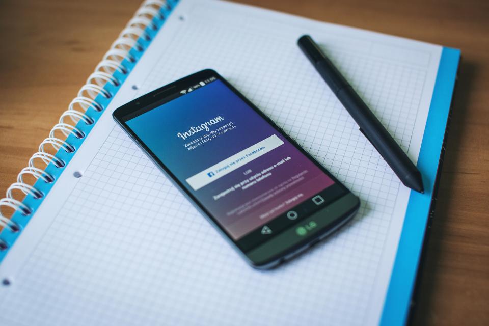 Facebook and Instagram ads on a smartphone for an Egyptian business