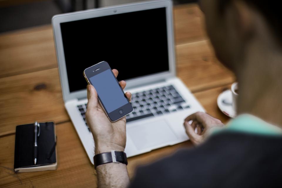 Egyptian business owner using WhatsApp Business on a smartphone